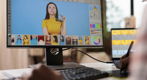 Retouching artist editing picture with retoucher software
